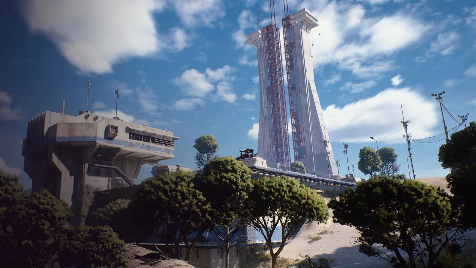 The Spaceport launch towers with a raised concrete control building in the foreground