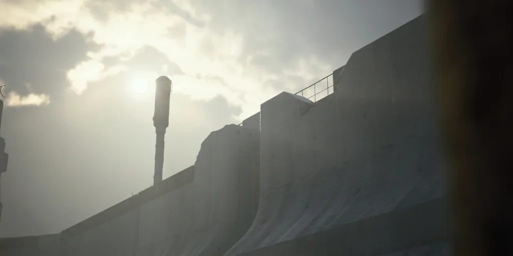 Battening Down quest art: a curved concrete seawall and a lamp post against a hazy sky