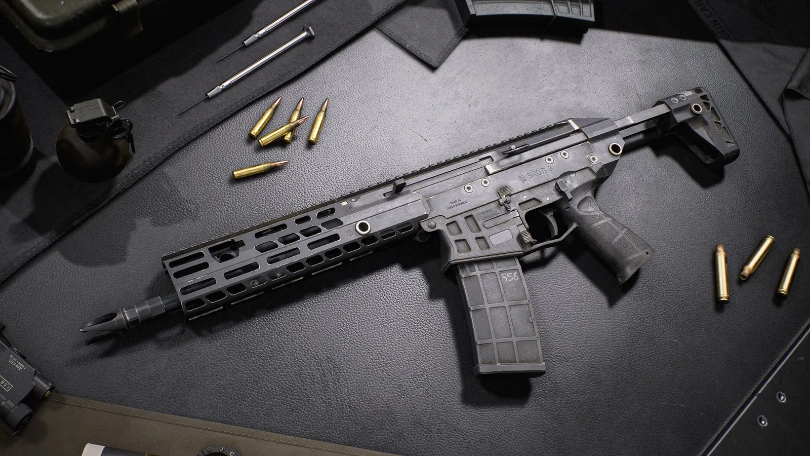 The BROD 3 carbine laid on a workbench with loose rifle cartridges