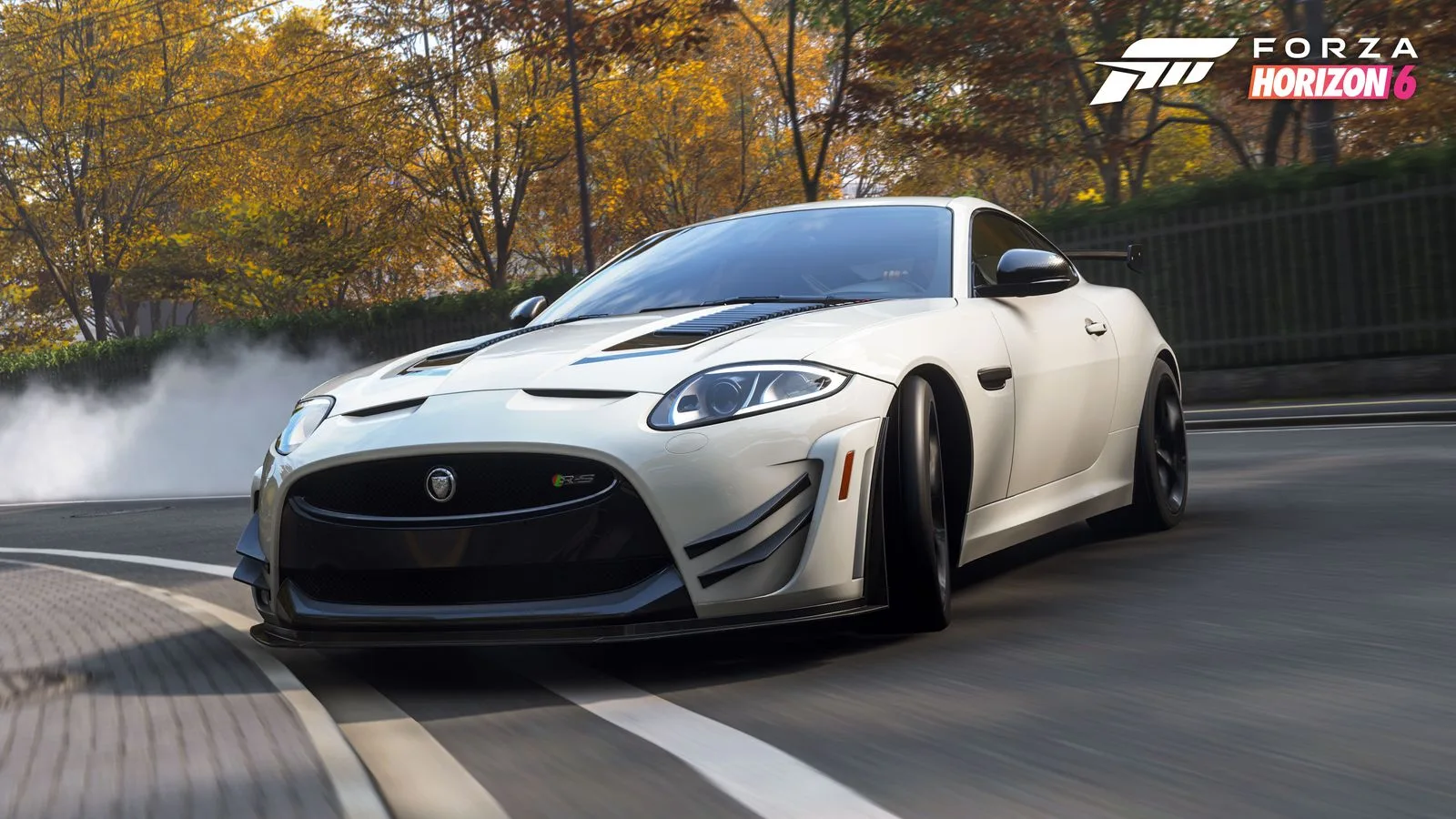 White 2015 Jaguar XKR-S GT drifting on an autumn road in Forza Horizon 6