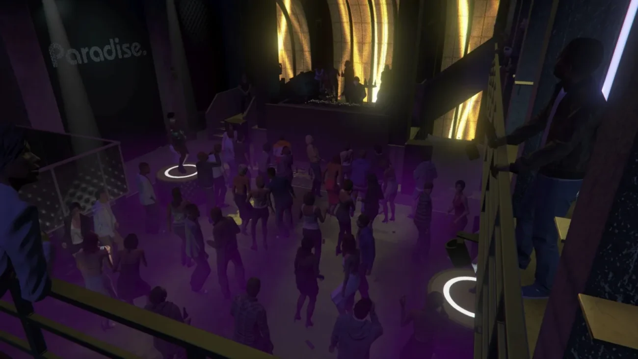 Crowded dance floor of a GTA Online nightclub with the DJ booth lit up
