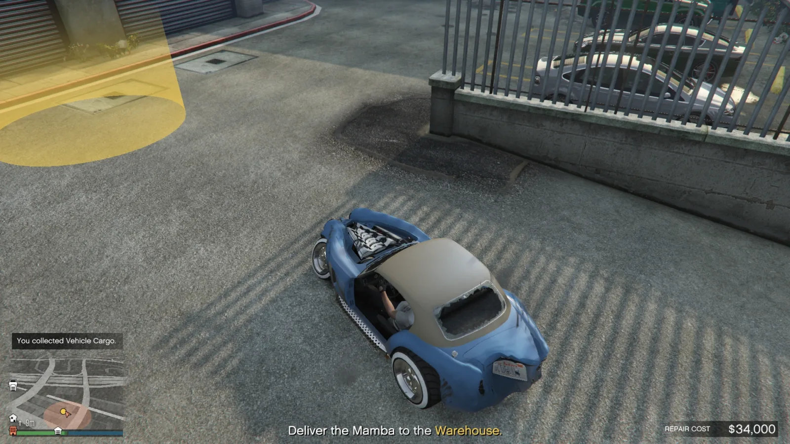 A badly damaged Mamba being delivered to a Vehicle Warehouse in GTA Online, with the repair cost counter showing the $34,000 maximum
