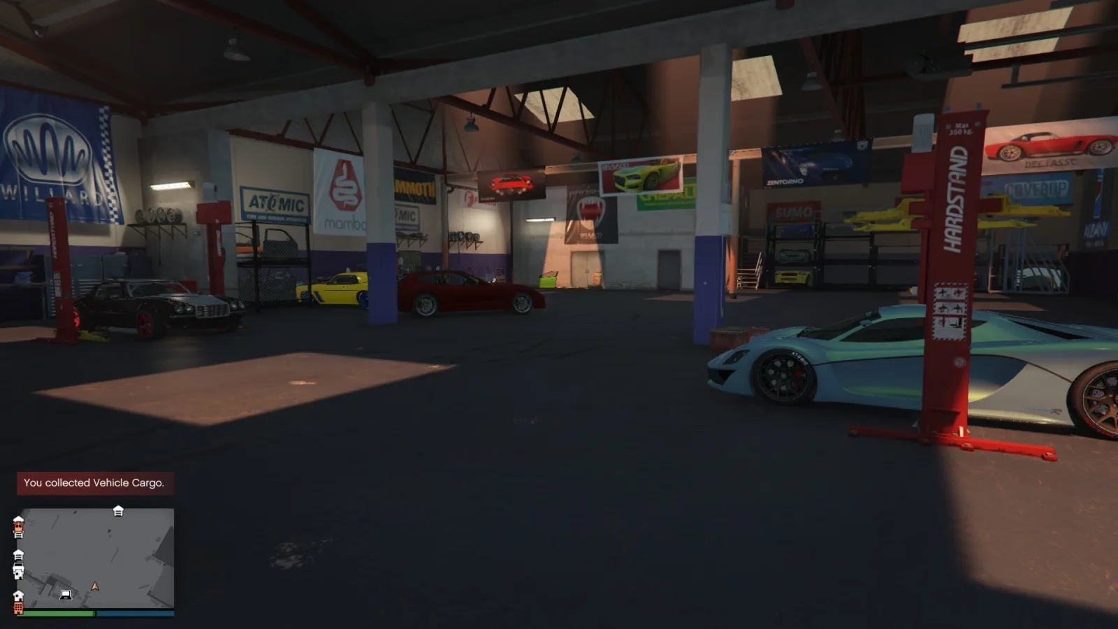 Inside a partially stocked Vehicle Warehouse in GTA Online, with several stolen sports cars parked beside red hydraulic lifts