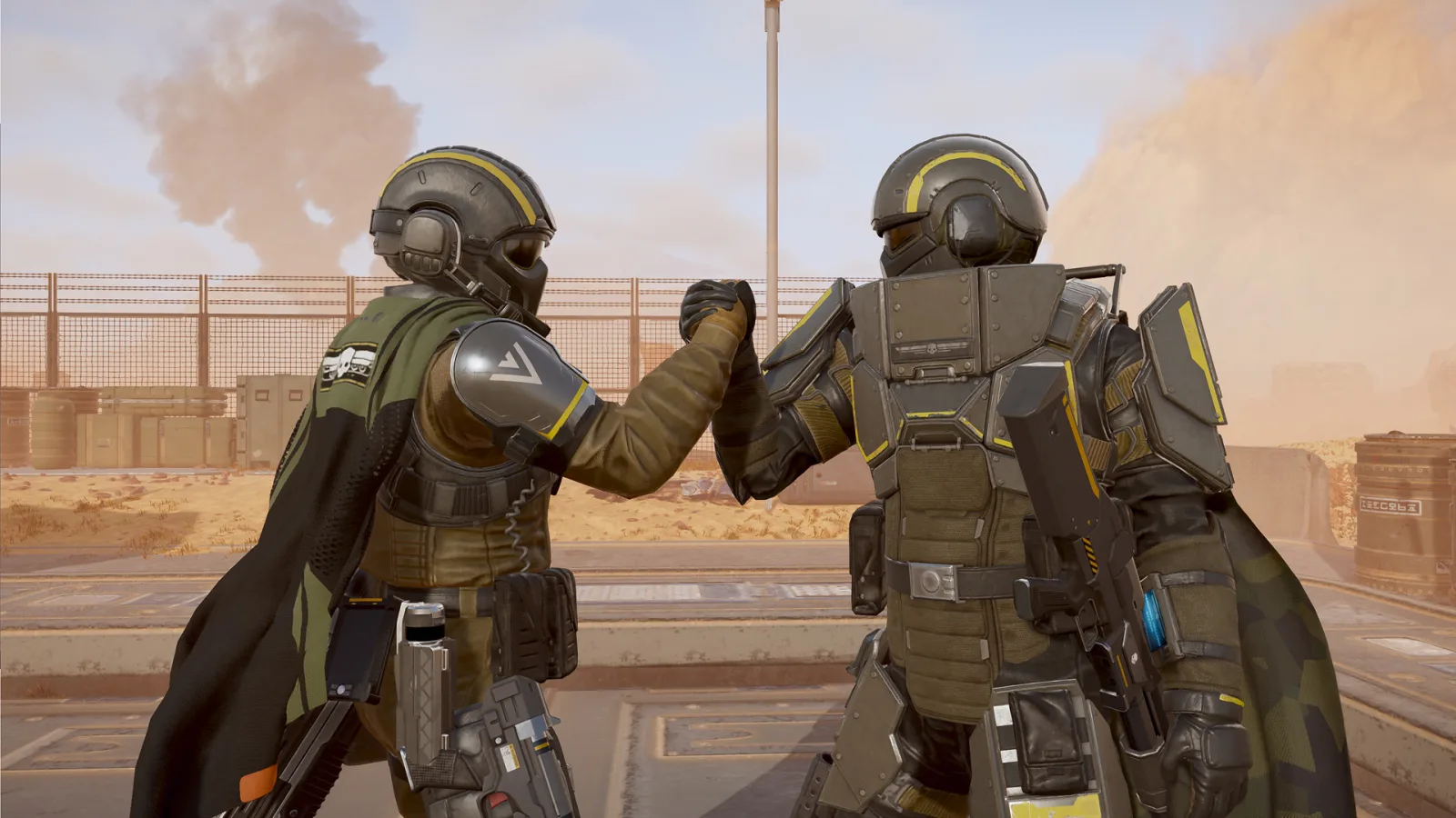 Two Helldivers clasping hands: on the left the light BFM-16 Tanker armor and helmet with the Standard of Rapid Evacuation cape, on the right the heavy BFM-220 Ironclad armor with its plated blast-shield collar