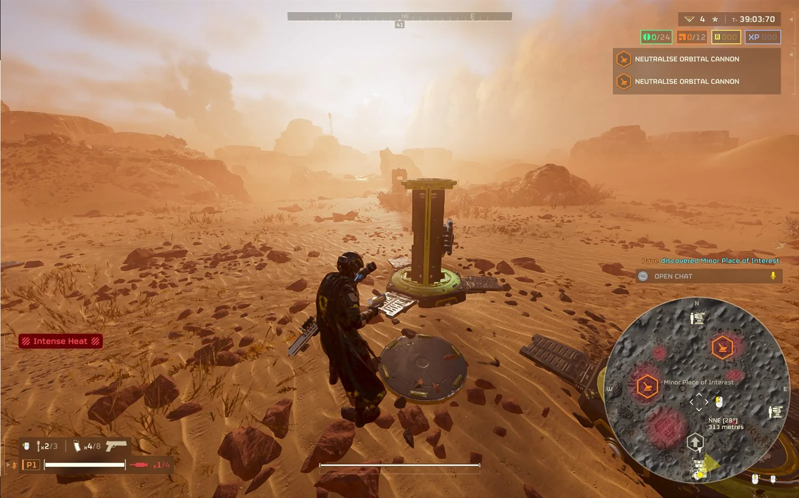 A Helldiver on a desert map with the minimap showing a Minor Place of Interest label and a discovery notice on screen