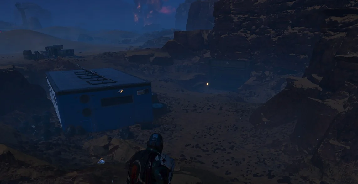 A Helldiver looking down at a bunker Minor Place of Interest next to a blue container in Helldivers 2