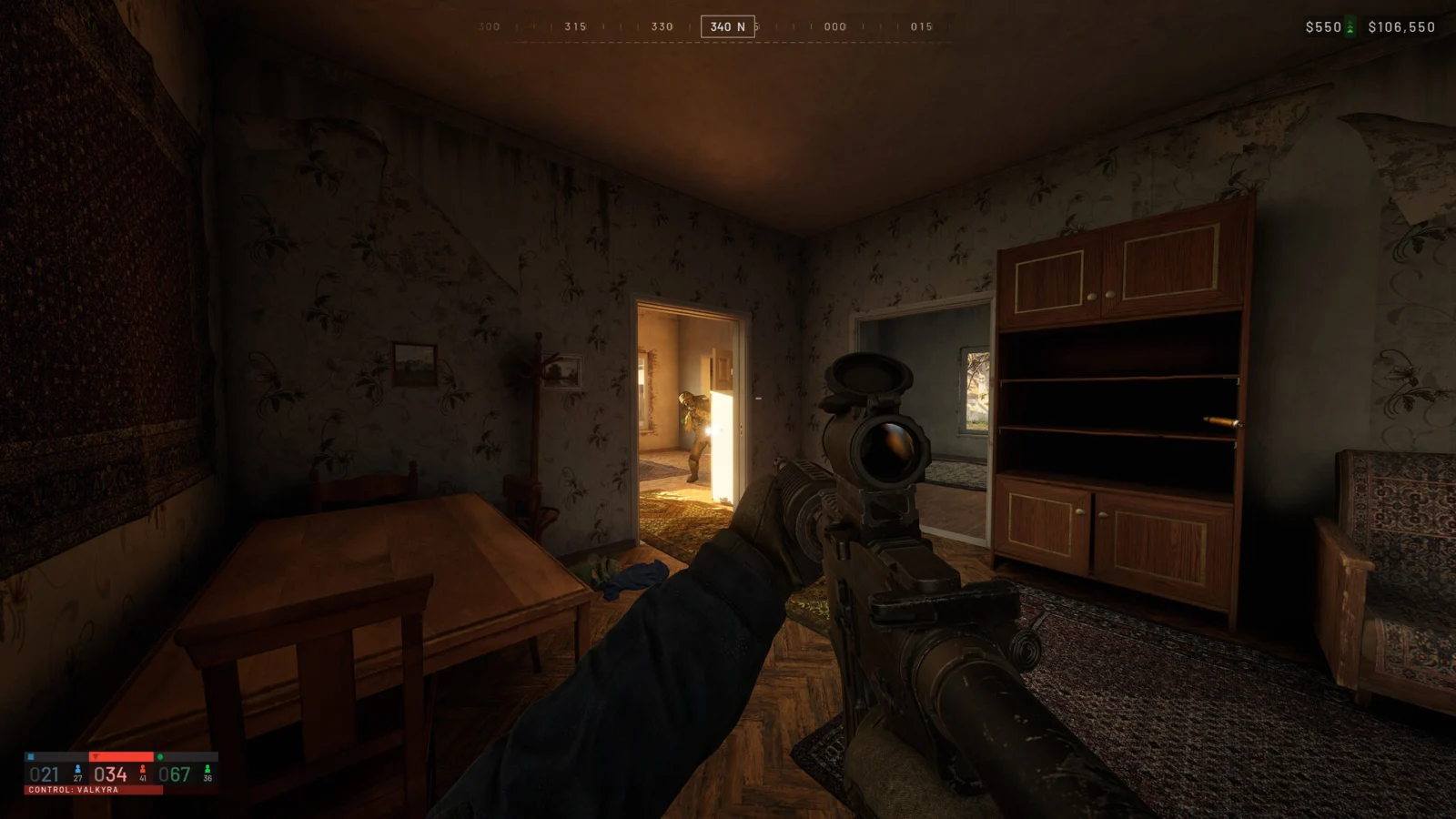 First-person view of a scoped rifle inside a house in Wardogs, with an enemy in the doorway