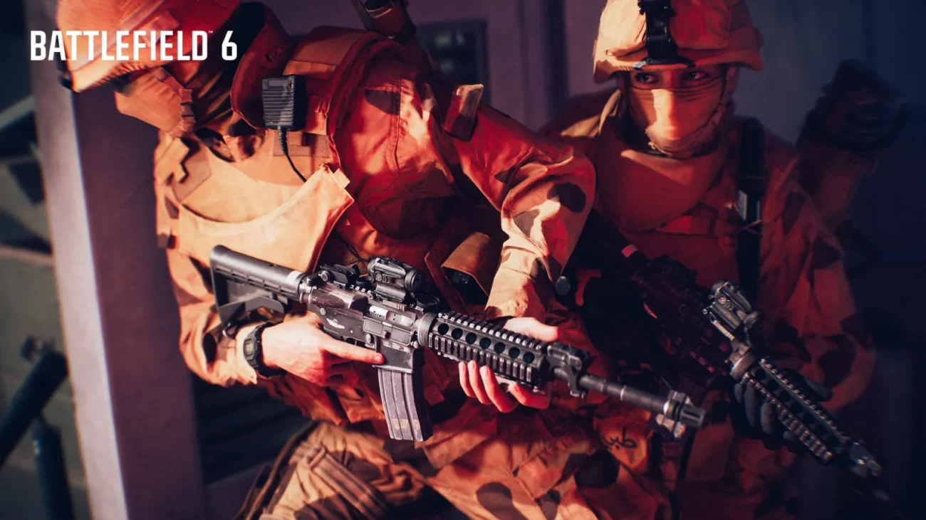Two Battlefield 6 soldiers in desert camouflage moving through a doorway, the front one holding an M4A1 carbine