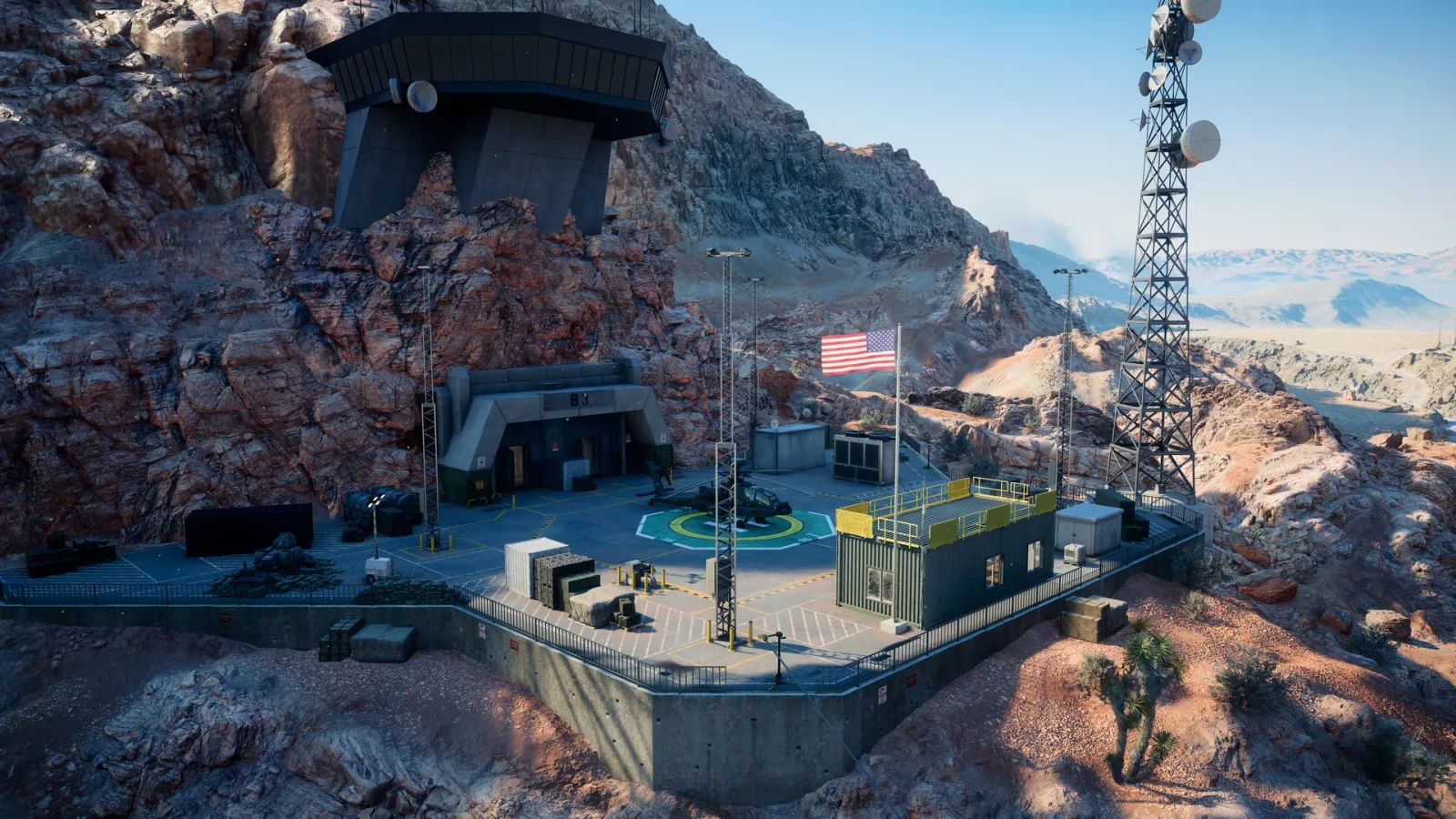 Area 51 base built into a desert mountain with a helipad, attack helicopter and comms tower in Battlefield 6