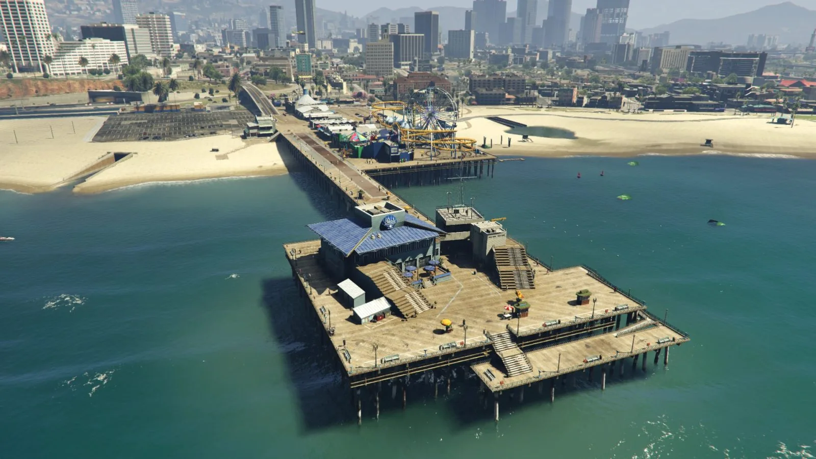 Del Perro Pier in Los Santos with its Ferris wheel and roller coaster seen from the beach