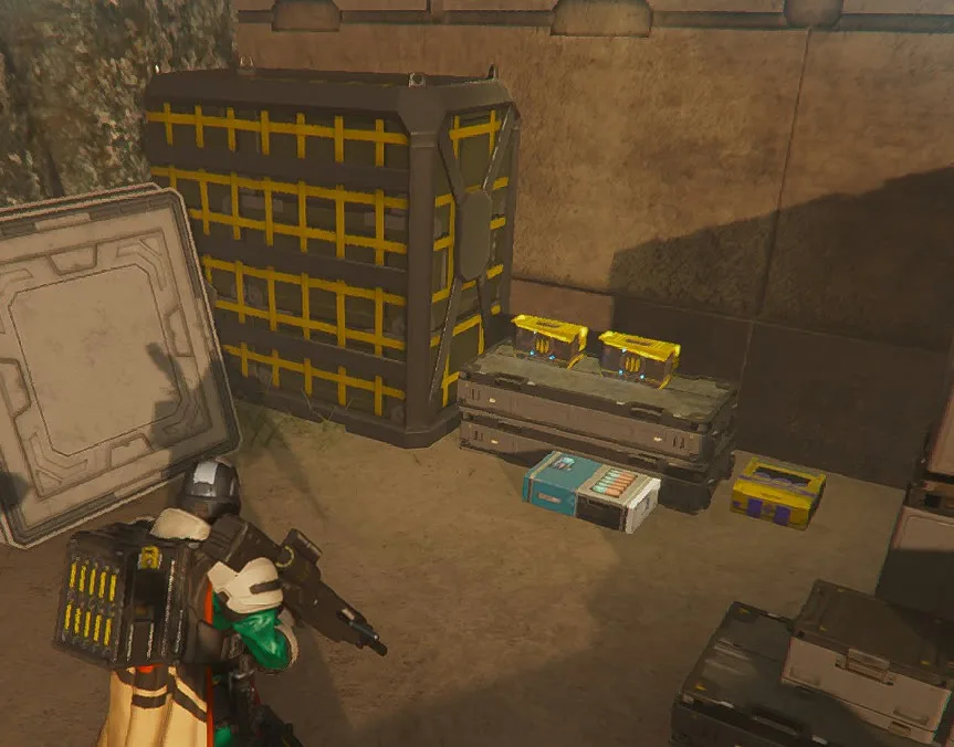 A Helldiver next to supply crates and ammo boxes inside the base on an Evacuate High-Value Assets map