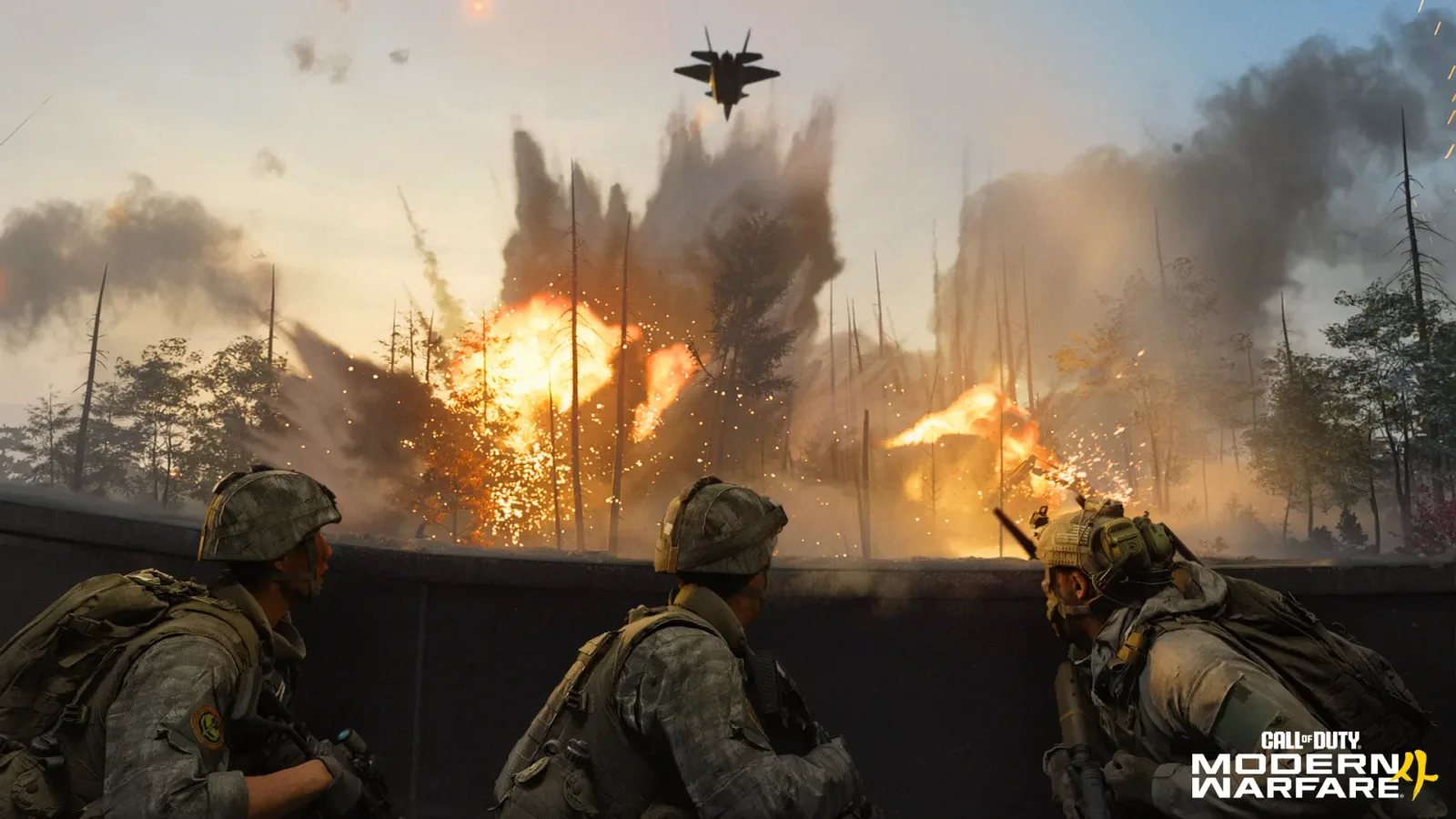 Three soldiers behind a concrete wall watch a fighter jet fly over a burning forest after an airstrike