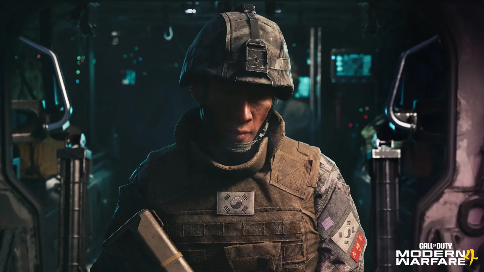 Private Park Hyun Jun in a South Korean army helmet and vest inside a dark armored vehicle