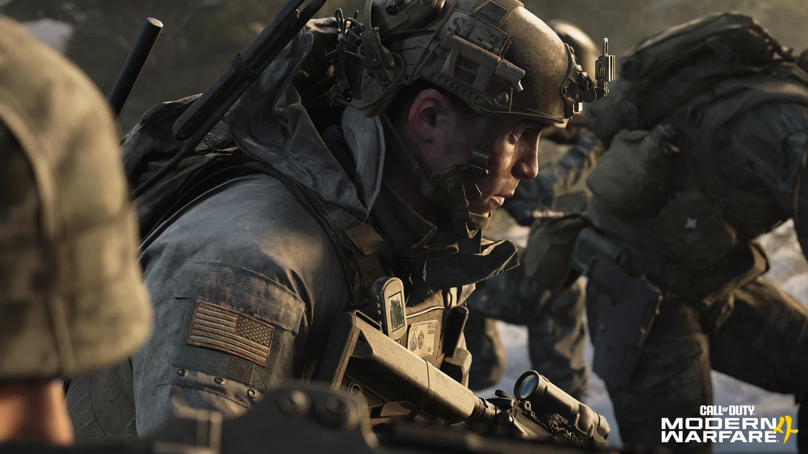 A soldier with a scoped rifle and an American flag patch moves through a snowy forest in the Modern Warfare 4 campaign