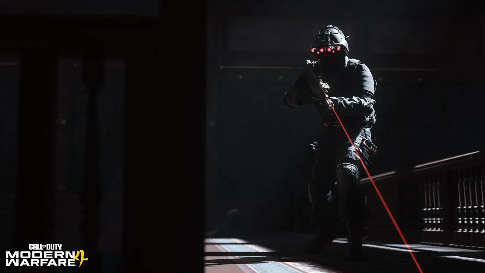 Operator with night vision goggles and a laser sight clearing a dark interior in Modern Warfare 4