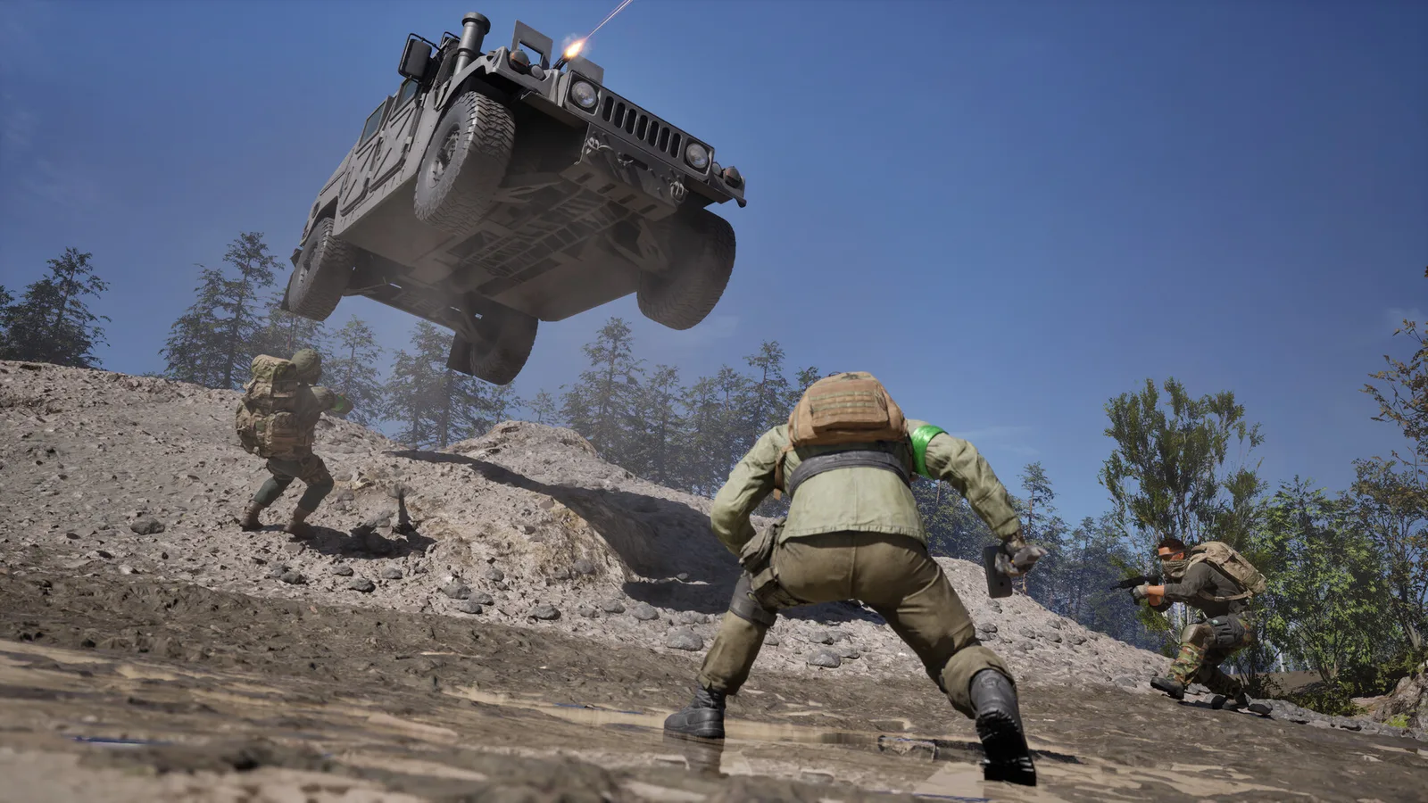 A Wardogs Humvee with a roof gunner jumping over a dirt ridge while three soldiers on foot react below